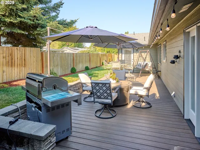 a view of outdoor dining space with furniture and wooden floor