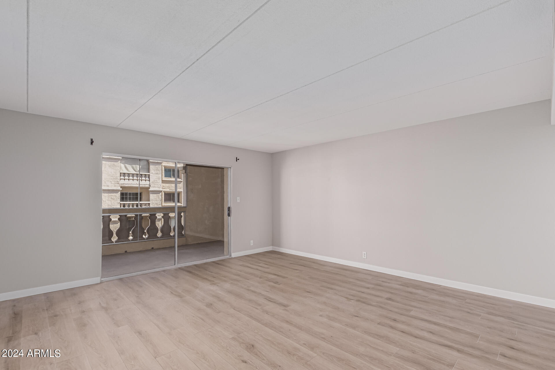 7930 East Camelback Road, Unit 506 Scottsdale, AZ 85251 - Photo 14 of 58 a view of an empty room with a window