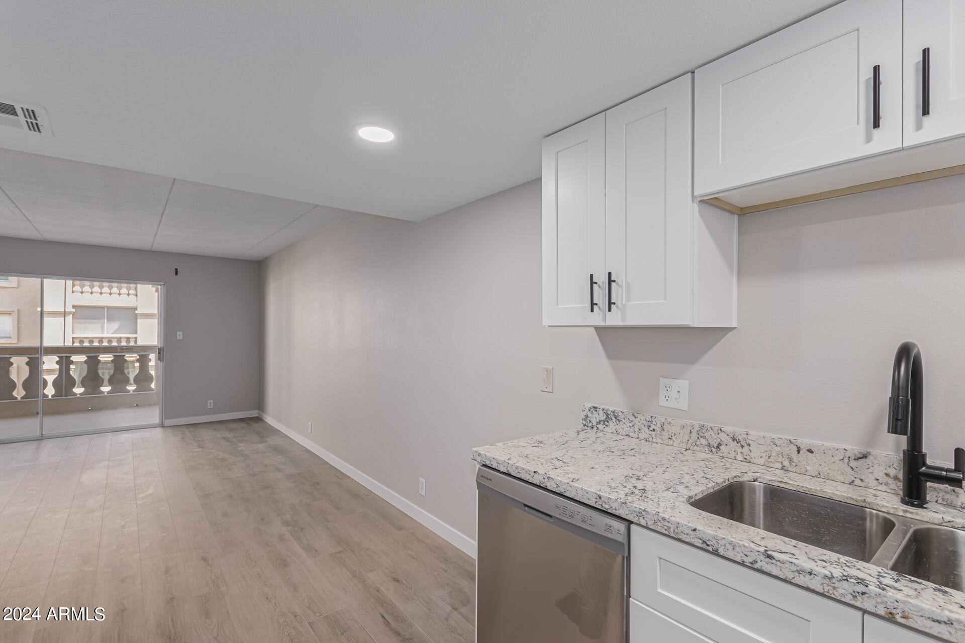 7930 East Camelback Road, Unit 506 Scottsdale, AZ 85251 - Photo 15 of 58 a kitchen with a sink and cabinets