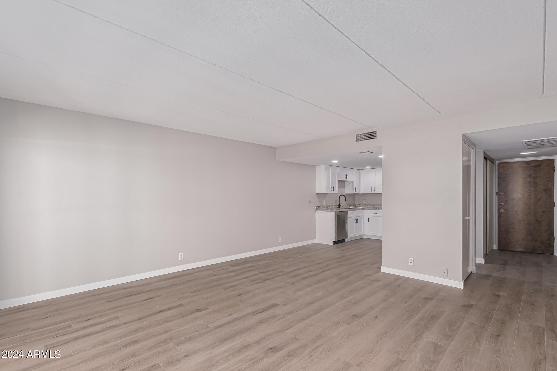 7930 East Camelback Road, Unit 506 Scottsdale, AZ 85251 - Photo 16 of 58 a view of empty room with wooden floor