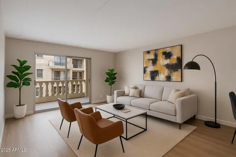 a living room with furniture and a potted plant