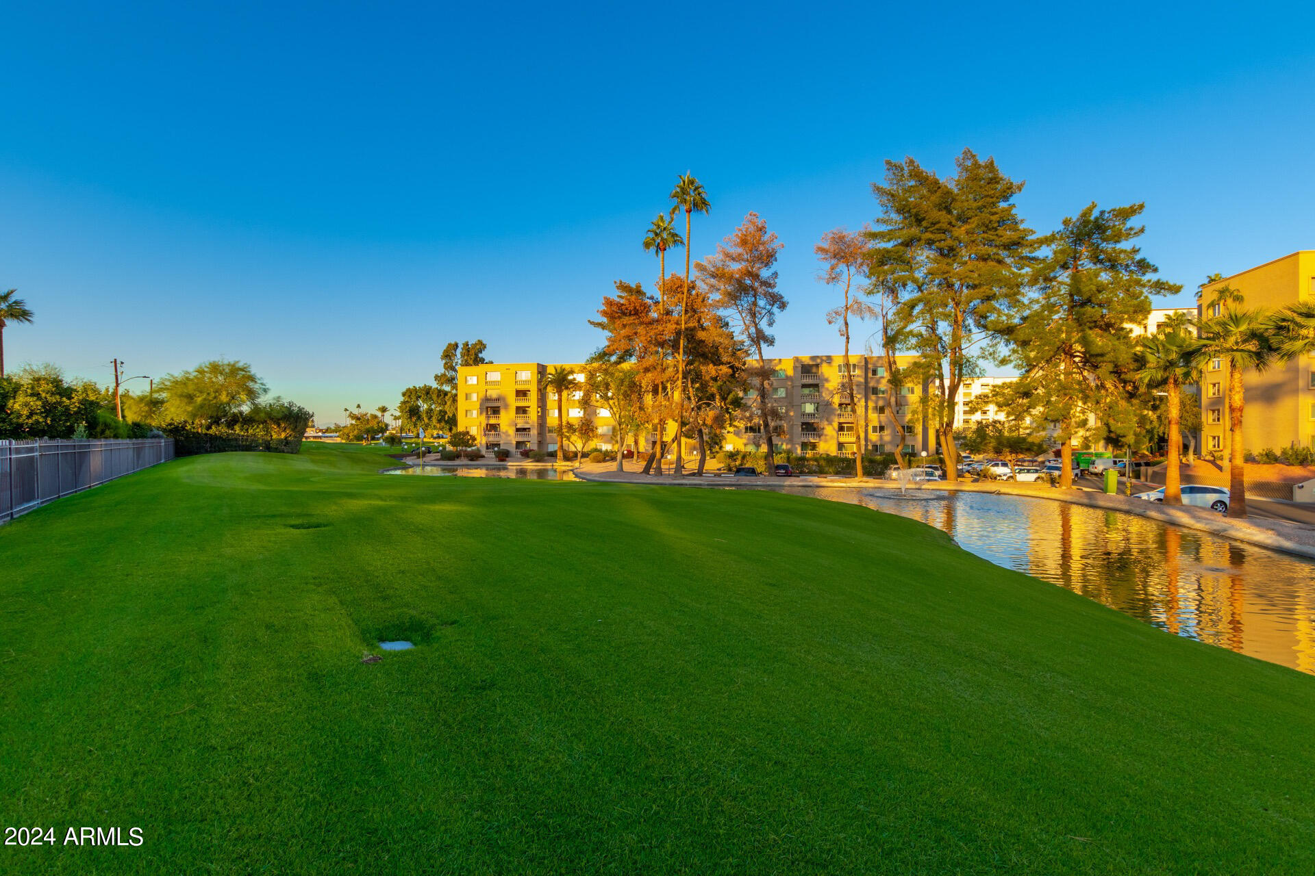 7930 East Camelback Road, Unit 506 Scottsdale, AZ 85251 - Photo 34 of 58 a view of a lake with houses
