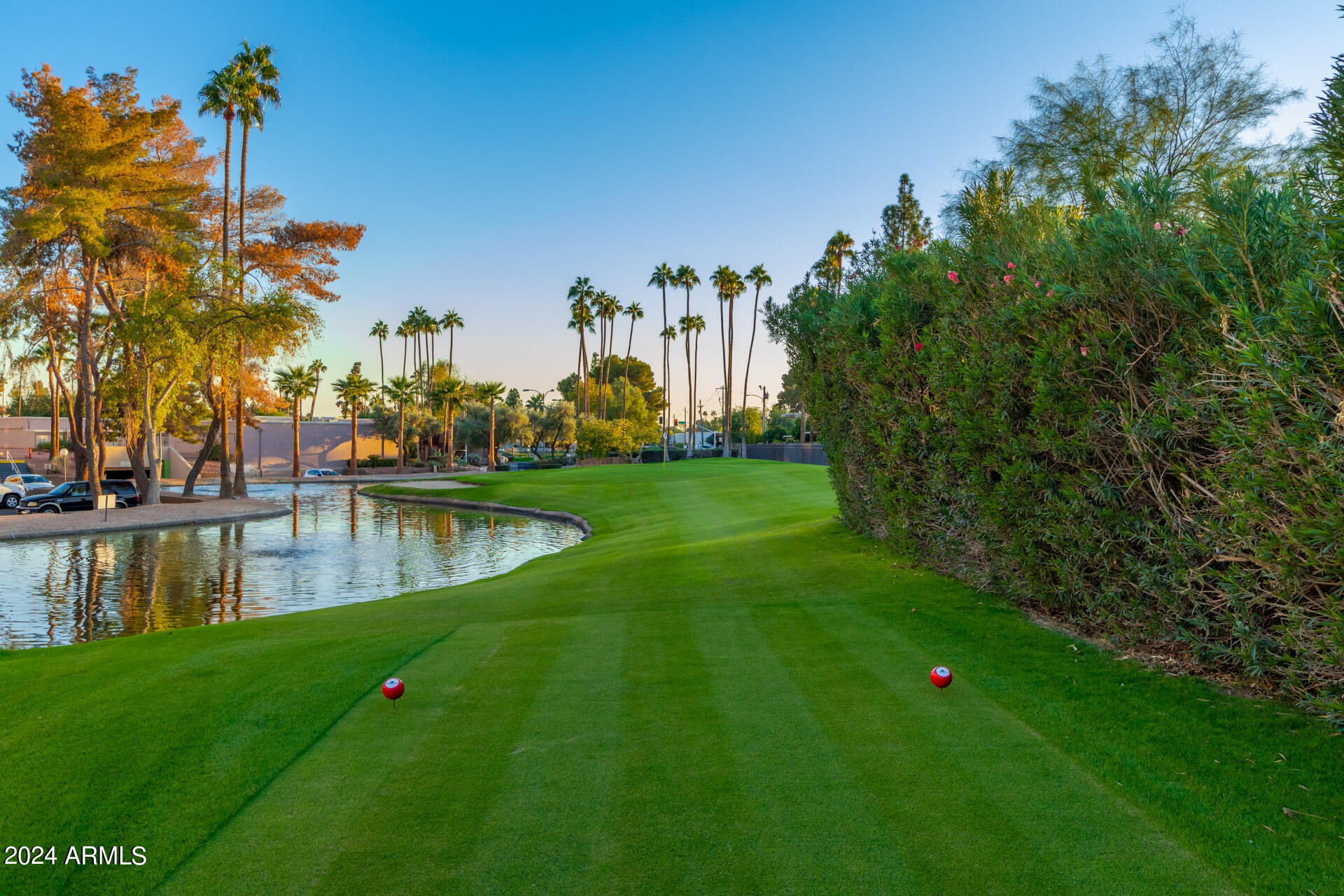 7930 East Camelback Road, Unit 506 Scottsdale, AZ 85251 - Photo 35 of 58 a view of a lake with a building in the background
