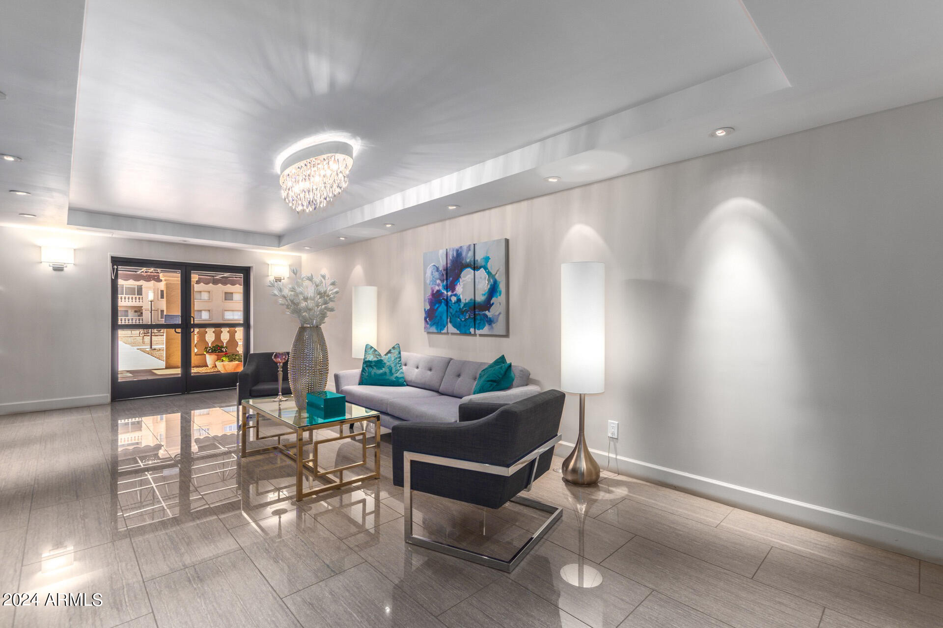 7930 East Camelback Road, Unit 506 Scottsdale, AZ 85251 - Photo 38 of 58 a living room with furniture a chandelier and a window