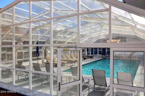 a view of a swimming pool with a lounge chairs