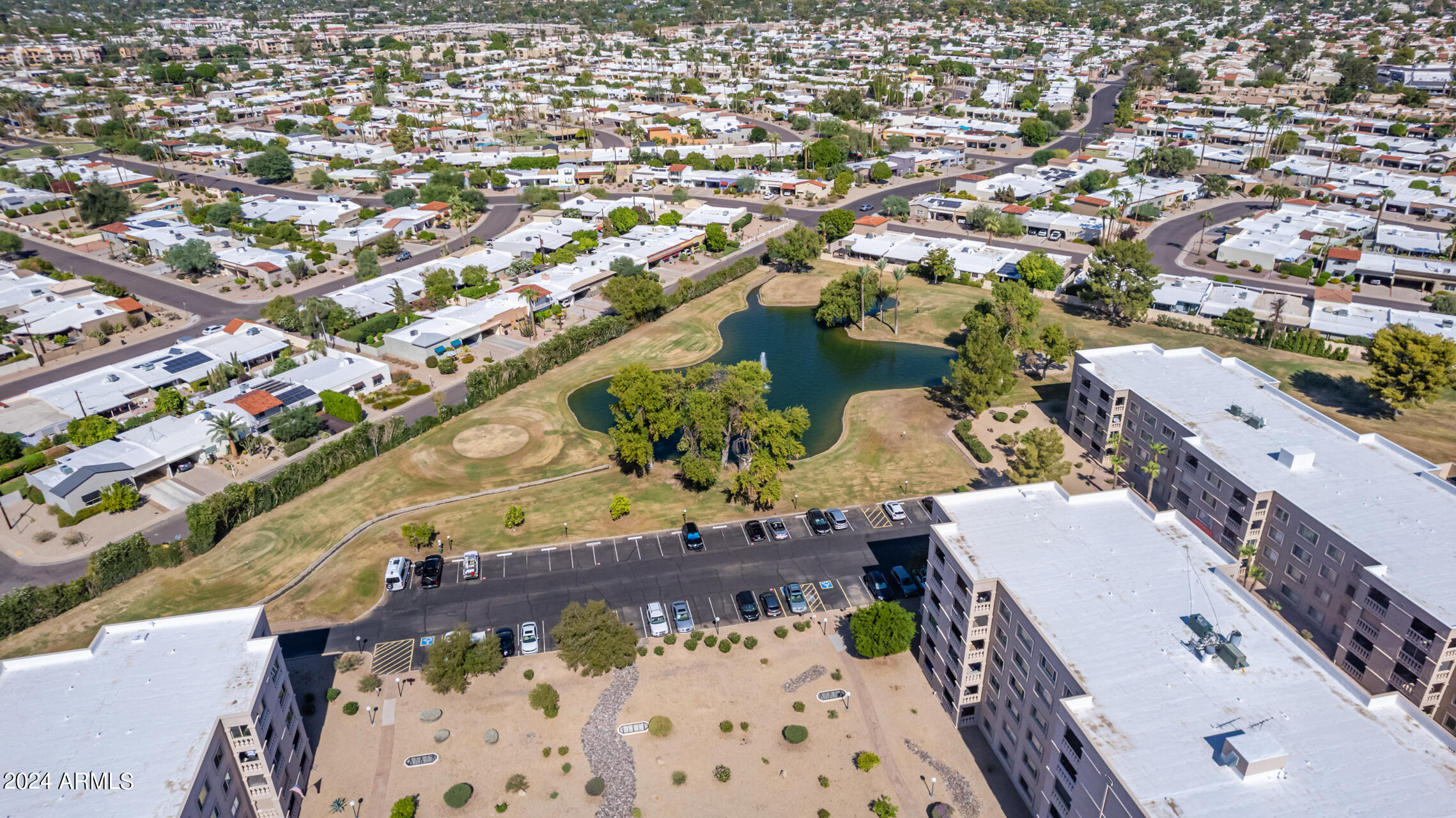 7930 East Camelback Road, Unit 506 Scottsdale, AZ 85251 - Photo 49 of 58 an aerial view of a house with a yard