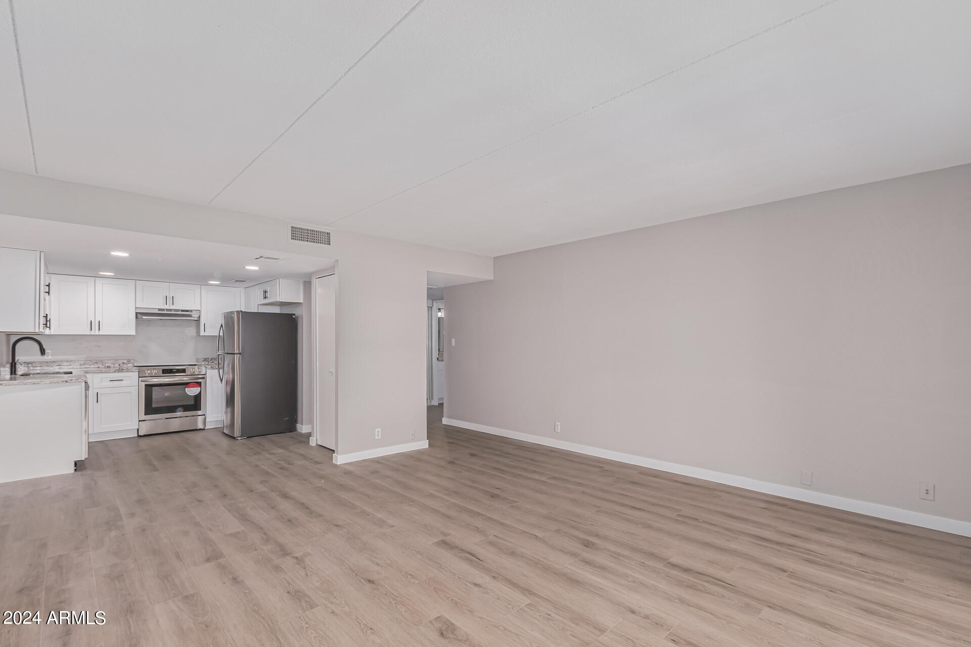 7930 East Camelback Road, Unit 506 Scottsdale, AZ 85251 - Photo 9 of 58 a view of kitchen with wooden floor