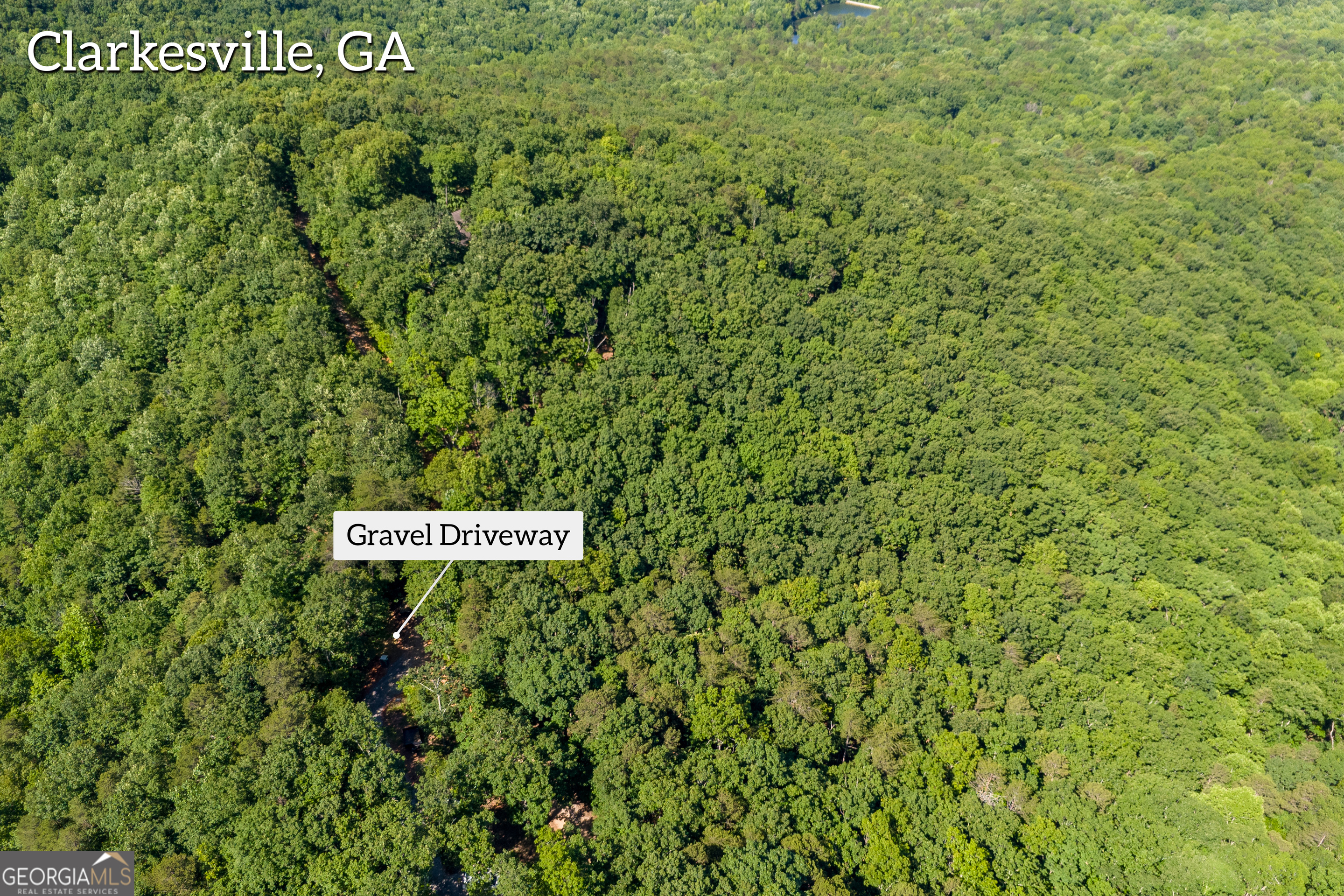 5012 Alec Mountain Road Clarkesville, GA 30523 - Photo 20 of 37 a sign broad in the middle of a forest