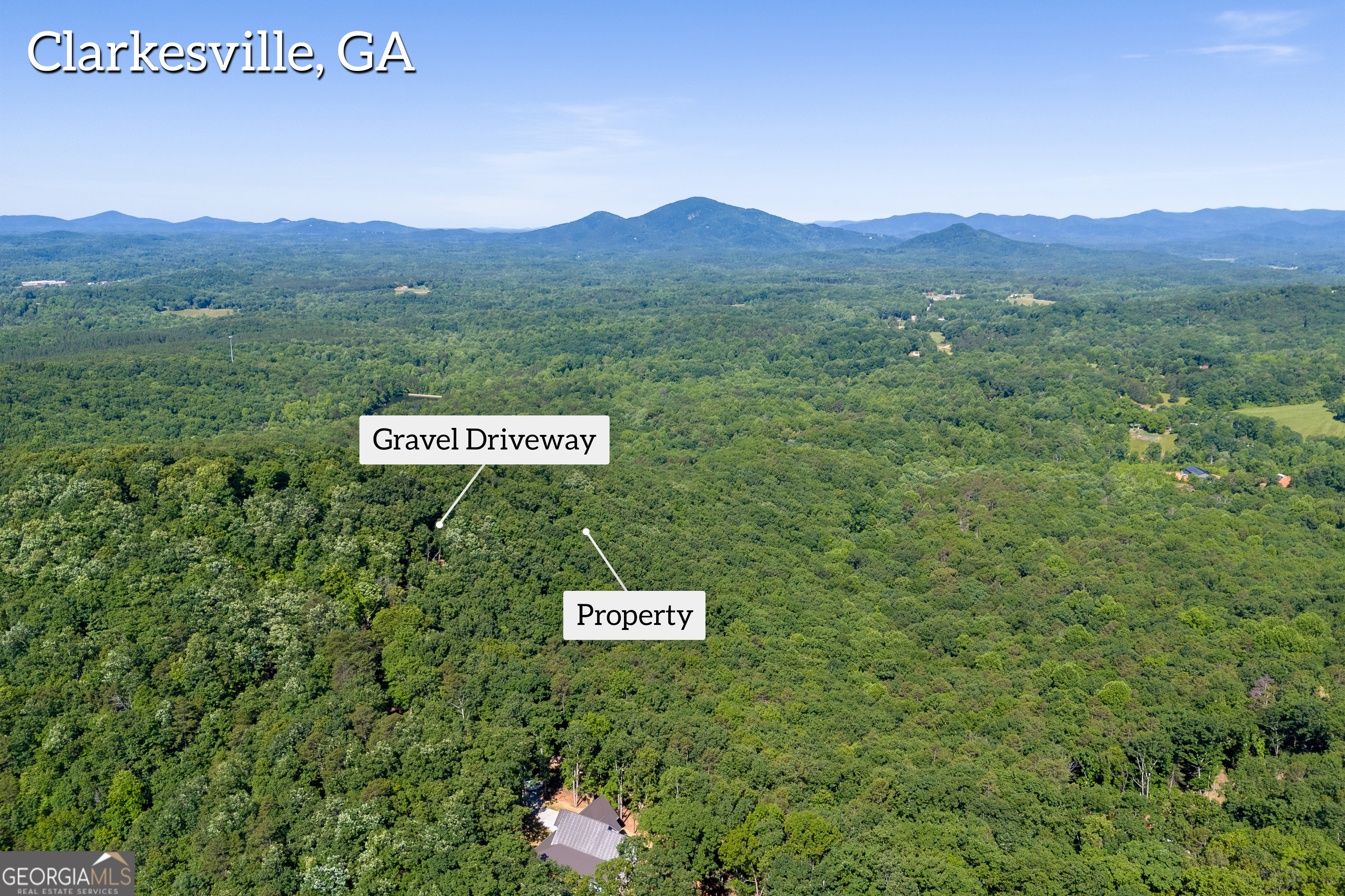 5012 Alec Mountain Road Clarkesville, GA 30523 - Photo 7 of 37 a sign that is sitting in the middle of a field
