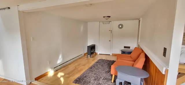 a room with furniture and a rug