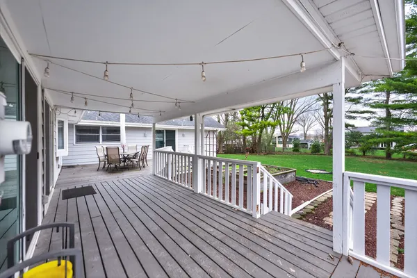 a view of a patio with wooden floor