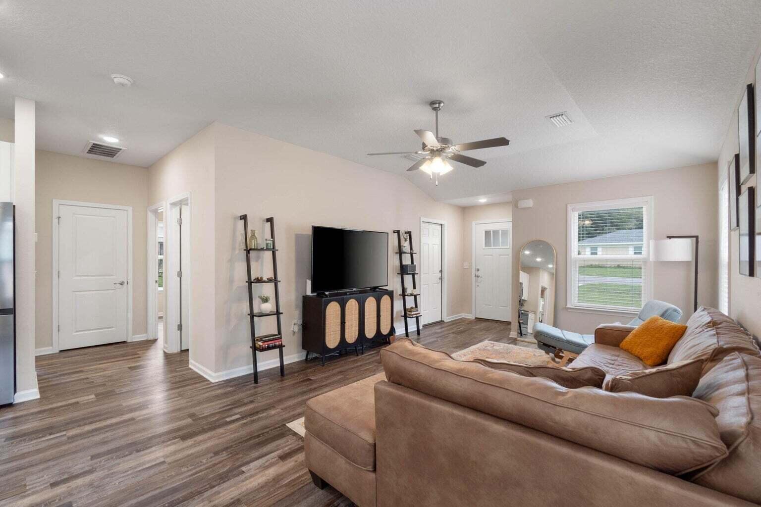 952 Mapoles Street Crestview, FL 32536 - Photo 6 of 32 a living room with furniture and a flat screen tv