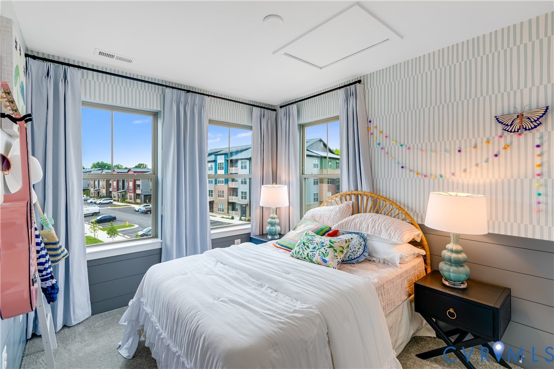 6103 Primrose Path Road Richmond, VA 23225 - Photo 19 of 23 a bedroom with a bed and a window