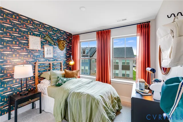 a bedroom with a bed and glass window