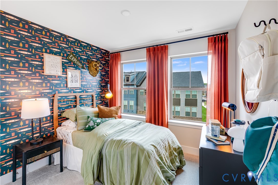 6103 Primrose Path Road Richmond, VA 23225 - Photo 21 of 23 a bedroom with a bed and glass window