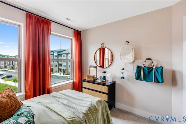 a bedroom with bed and a window