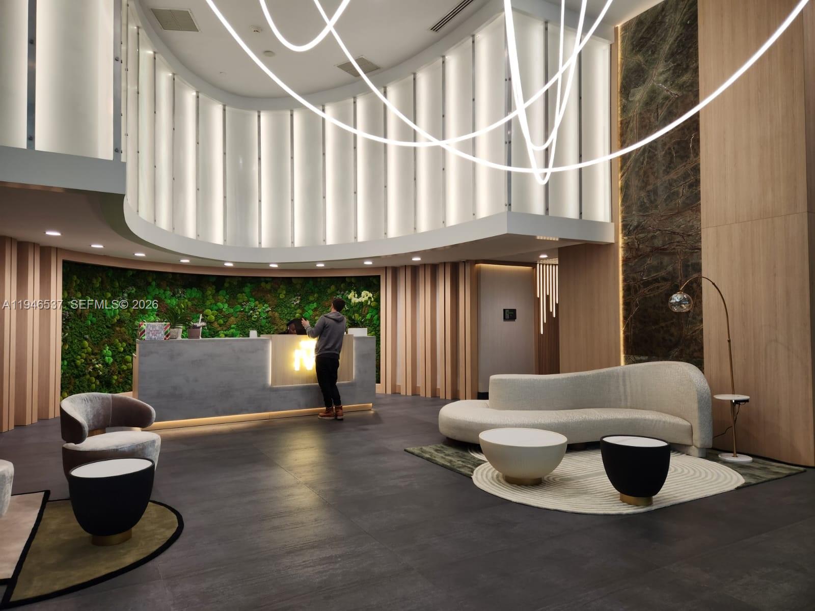 90 Southwest 3rd Street, Unit 3706 Miami, FL 33130 - Photo 2 of 21 a living room with furniture and a large window