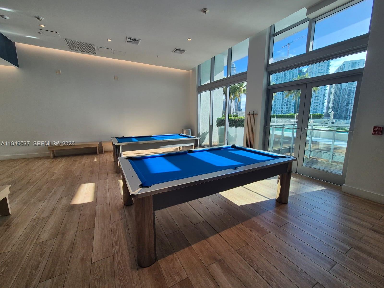 90 Southwest 3rd Street, Unit 3706 Miami, FL 33130 - Photo 4 of 21 a room with pool table and windows
