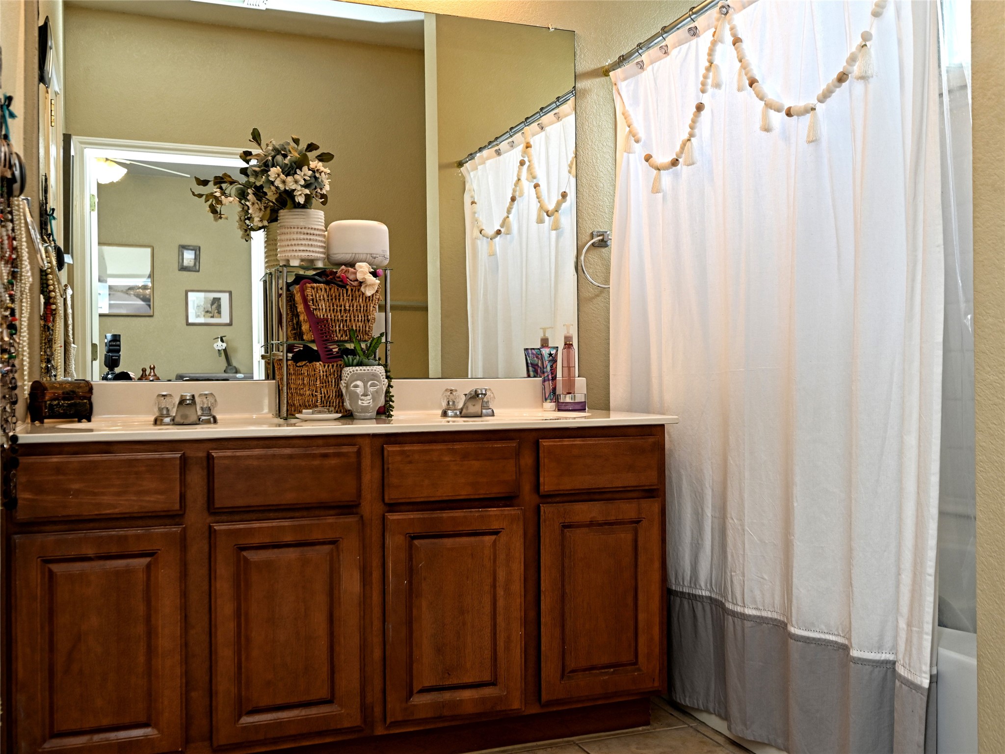 11401 Dimmitt Street Manor, TX 78653 - Photo 16 of 23 a bathroom with a double vanity sink and a mirror