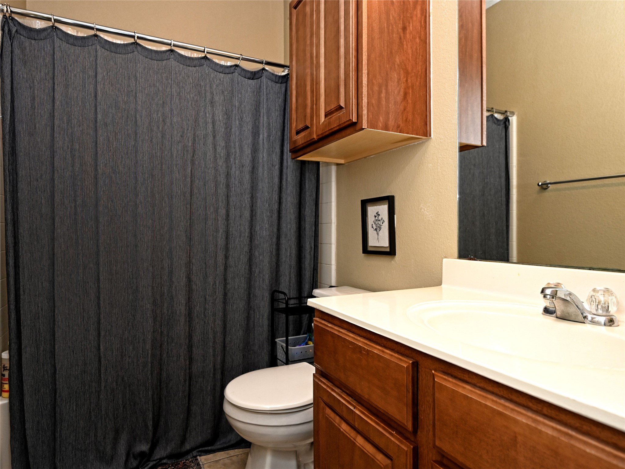 11401 Dimmitt Street Manor, TX 78653 - Photo 18 of 23 a bathroom with a sink a toilet and shower