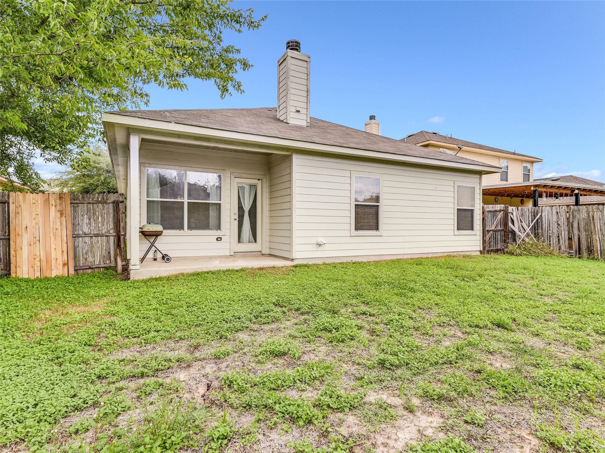 11401 Dimmitt Street Manor, TX 78653 - Photo 22 of 23 a front view of a house with a garden