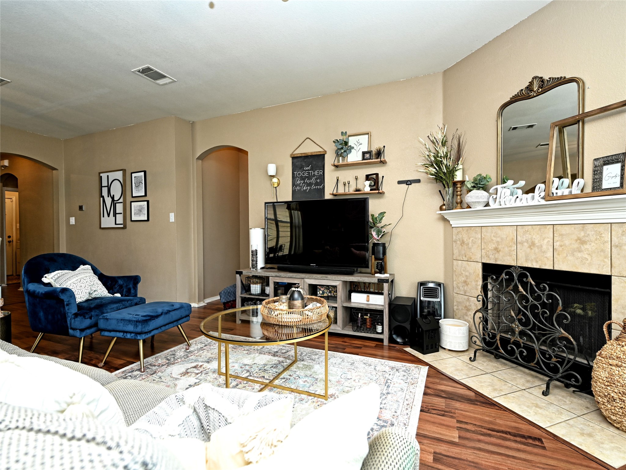 11401 Dimmitt Street Manor, TX 78653 - Photo 5 of 23 a living room with furniture a fireplace and a flat screen tv