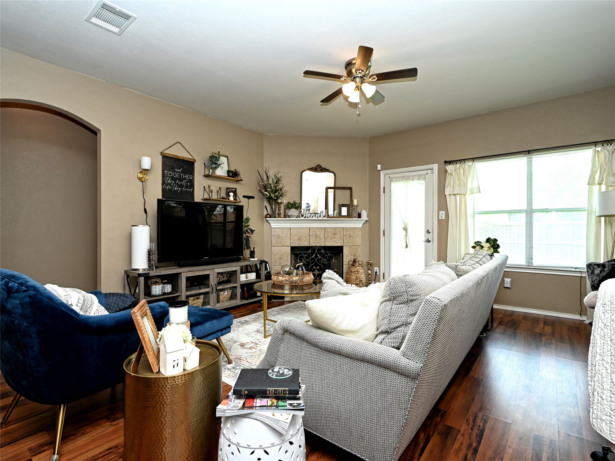 11401 Dimmitt Street Manor, TX 78653 - Photo 6 of 23 a living room with furniture fireplace and a flat screen tv