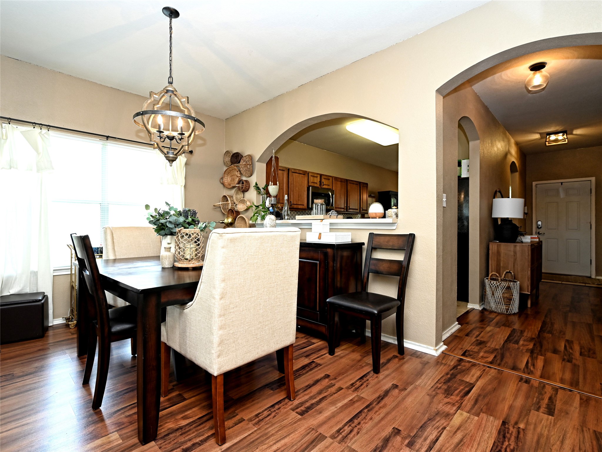 11401 Dimmitt Street Manor, TX 78653 - Photo 8 of 23 a view of a dining room with furniture window and wooden floor