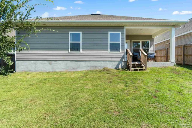 a view of a backyard of the house
