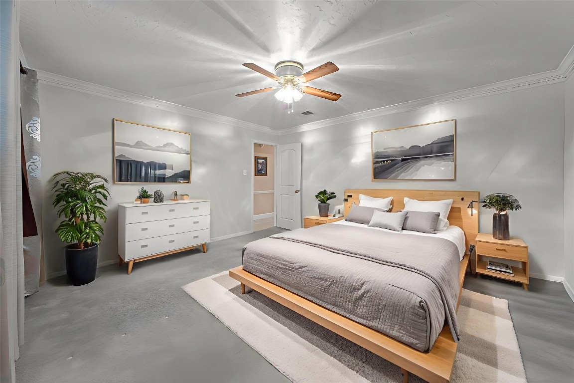 3805 Darling Street Pasadena, TX 77503 - Photo 10 of 23 a bedroom with a bed and ceiling fan