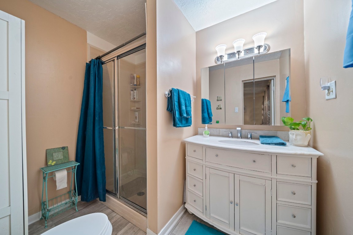 3805 Darling Street Pasadena, TX 77503 - Photo 11 of 23 a bathroom with a granite countertop sink vanity and mirror