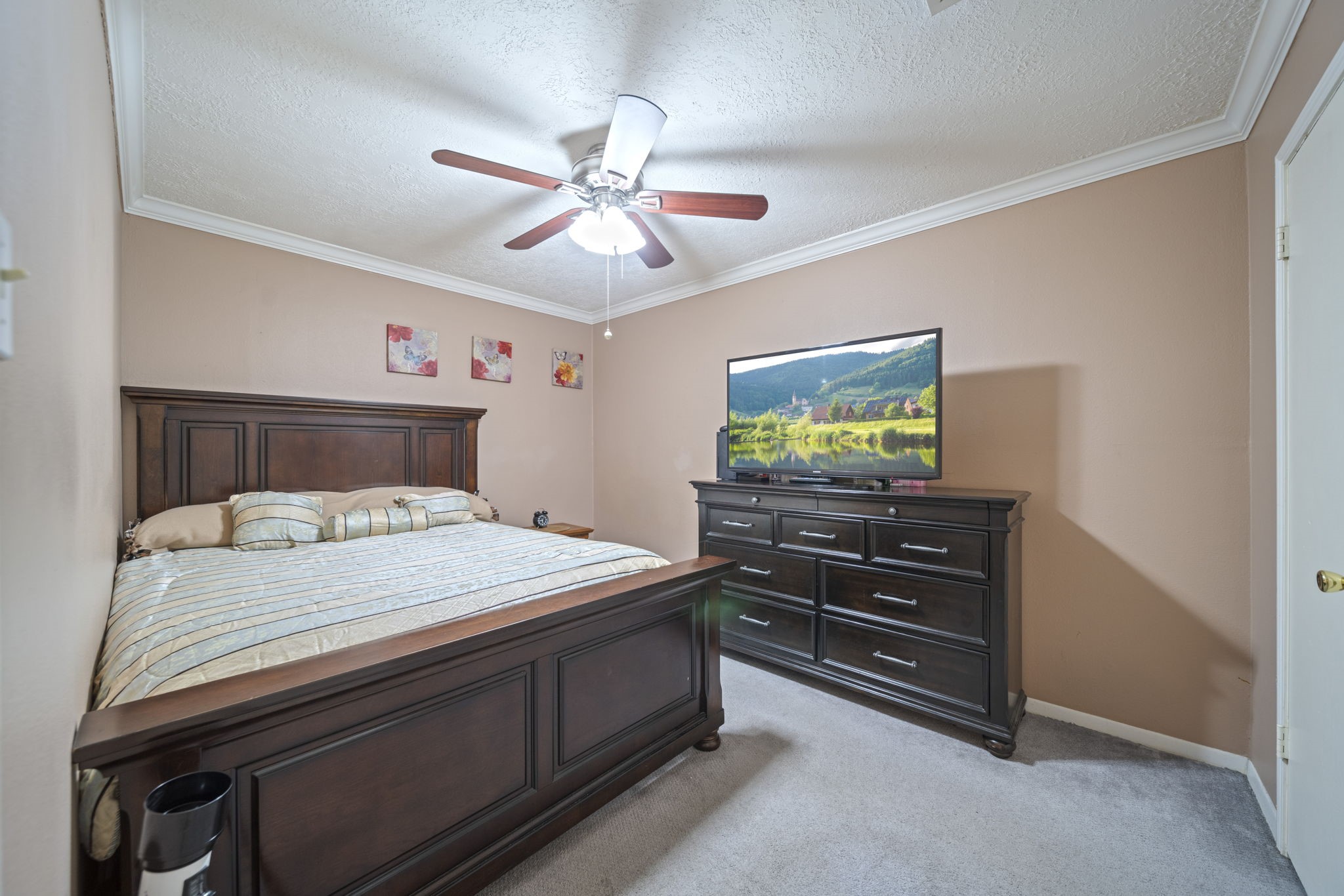 3805 Darling Street Pasadena, TX 77503 - Photo 13 of 23 a bedroom with a bed and a chandelier