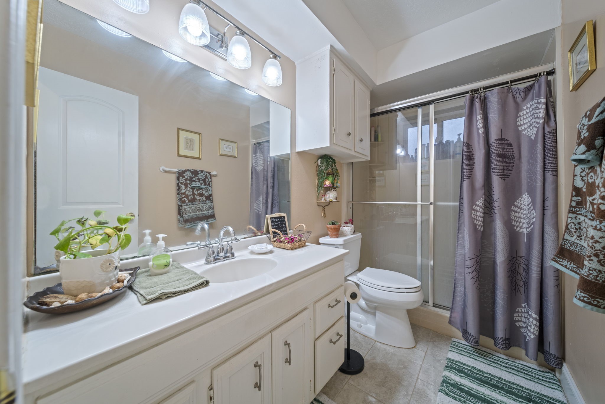 3805 Darling Street Pasadena, TX 77503 - Photo 15 of 23 a bathroom with a sink a toilet and shower
