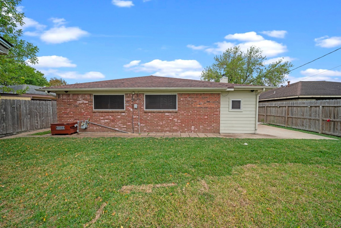 3805 Darling Street Pasadena, TX 77503 - Photo 18 of 23 a front view of house with yard and trees in the background
