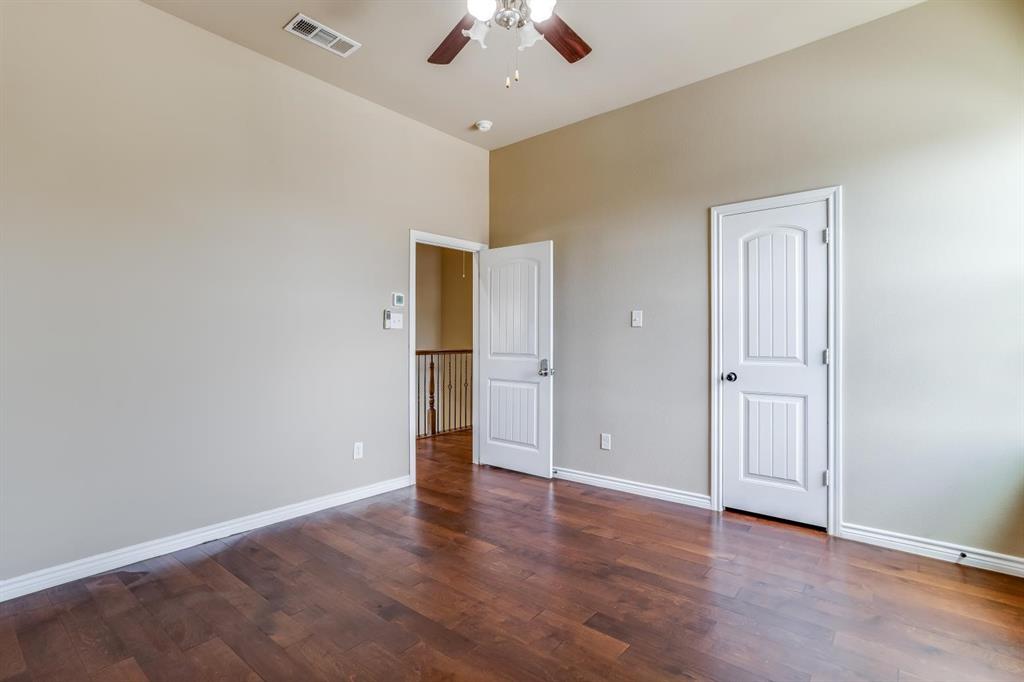 12364 Halima Street Dallas, TX 75243 - Photo 24 of 30 Wood-finish flooring, neutral wall tones, ceiling fan with integrated lighting, and white paneled doors