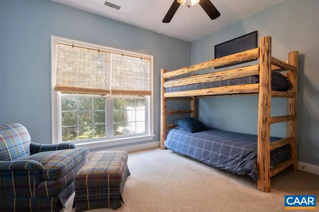 a close view of a stove a sink and a mirror