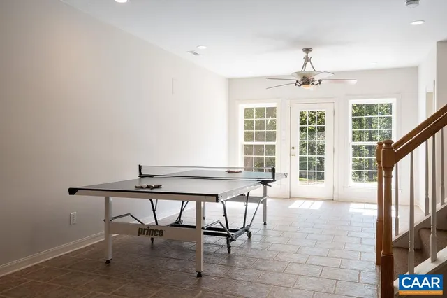 a view of a dining room with furniture and a window