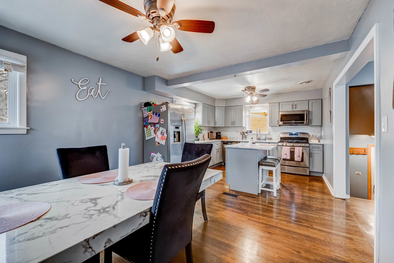 4147 Gage Avenue Lyons, IL 60534 - Photo 11 of 33 a view of a dining room with furniture and a kitchen