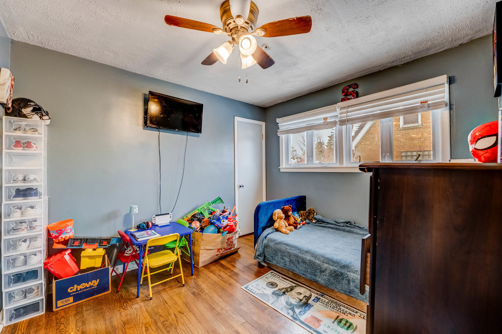 4147 Gage Avenue Lyons, IL 60534 - Photo 12 of 33 a bedroom with furniture and a chandelier fan