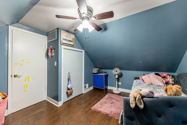a bedroom with furniture and a chandelier