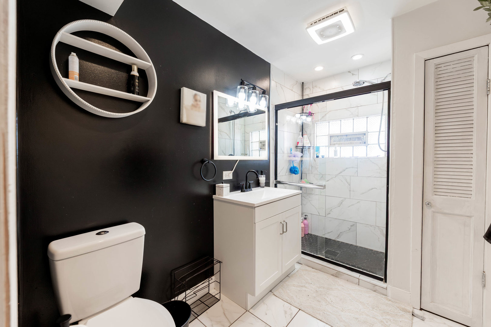 4147 Gage Avenue Lyons, IL 60534 - Photo 17 of 33 a bathroom with a toilet sink and mirror