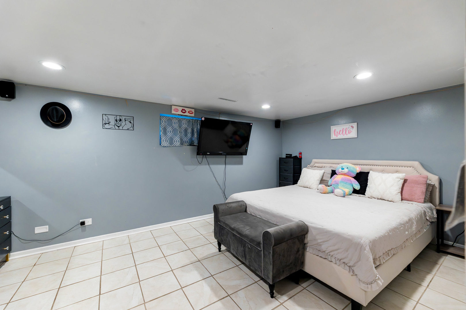 4147 Gage Avenue Lyons, IL 60534 - Photo 22 of 33 a bedroom with a bed and a flat screen tv
