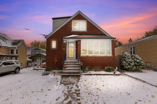 an aerial view of residential house with parking