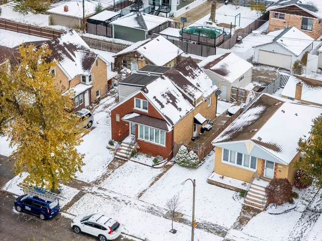 a picture of a bench in front of a wall