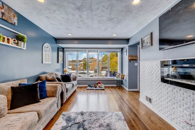 a living room with furniture fireplace and flat screen tv