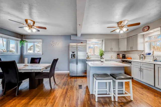 a view of a dining room with furniture window and wooden floor