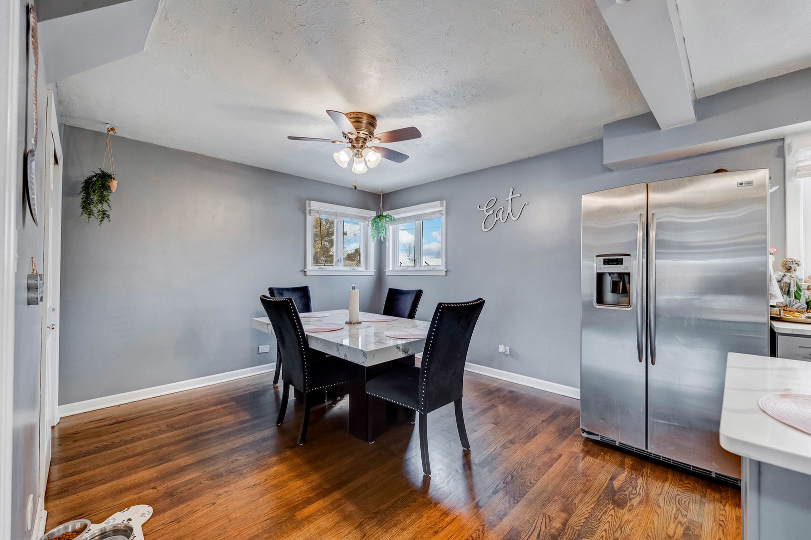 4147 Gage Avenue Lyons, IL 60534 - Photo 10 of 33 a view of a dining room with furniture a chandelier and wooden floor