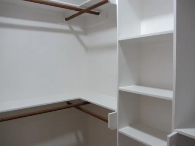 a view of an empty walk in closet
