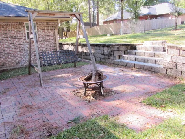 a view of a backyard with a patio
