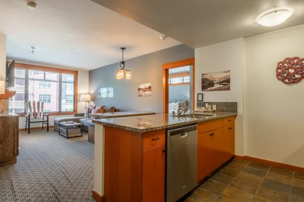 a kitchen with a sink and cabinets